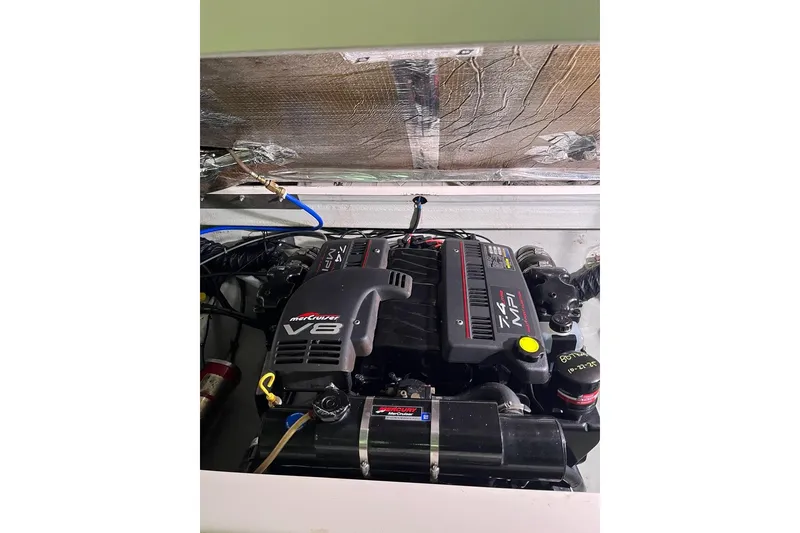 Slide: The Image of Engine compartment of a 2000 Pursuit 2860 Denali with MerCruiser V8 engine. - 19