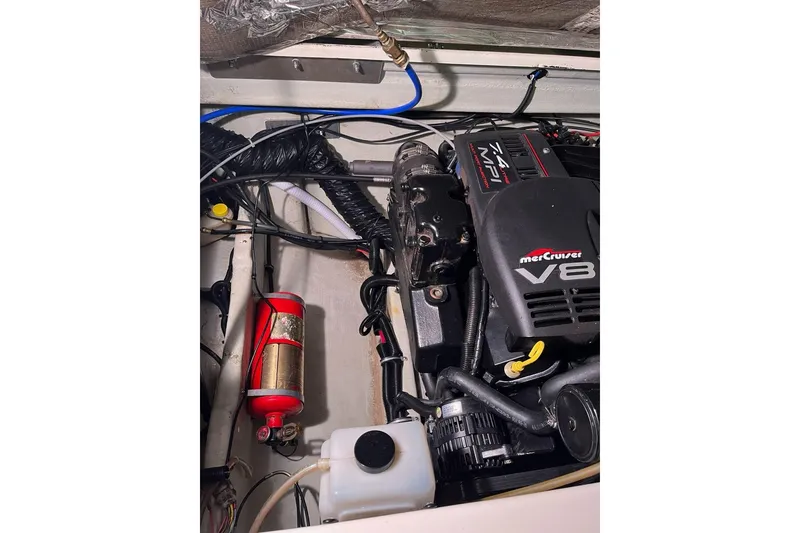 Slide: The Image of Engine compartment of a 2000 Pursuit 2860 Denali with MerCruiser V8 engine. - 17