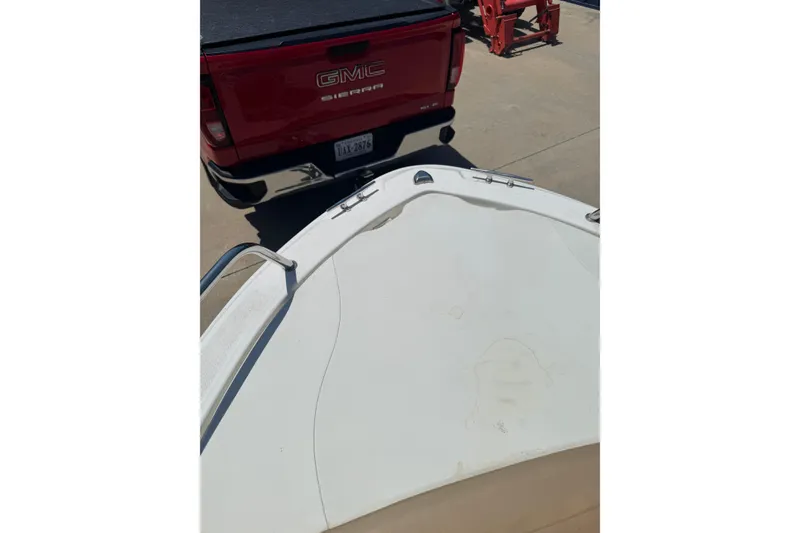 Slide: The Image of Bow of 2018 Edgewater 158CS boat near red GMC Sierra truck. - 8
