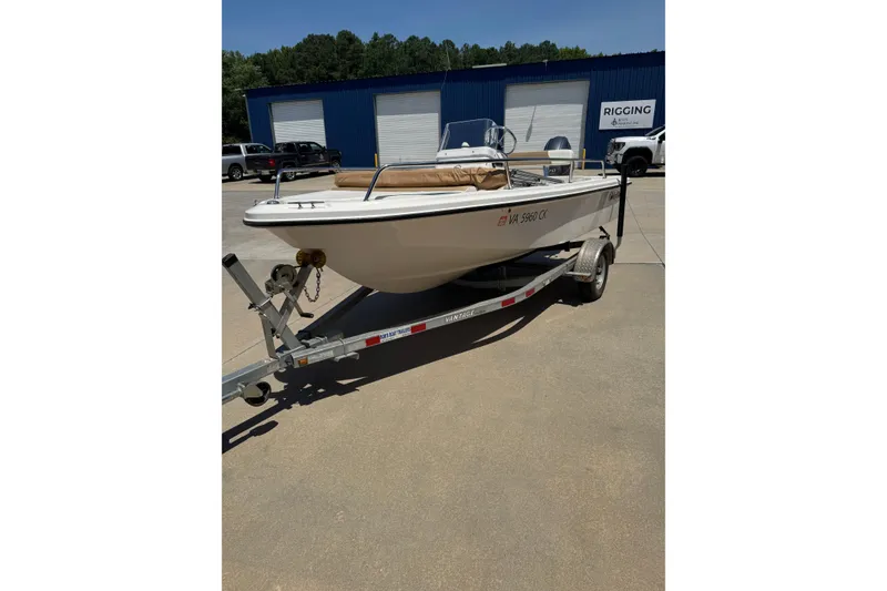 The Image of 2018 Edgewater 158CS boat on trailer in sunny outdoor setting. - 0