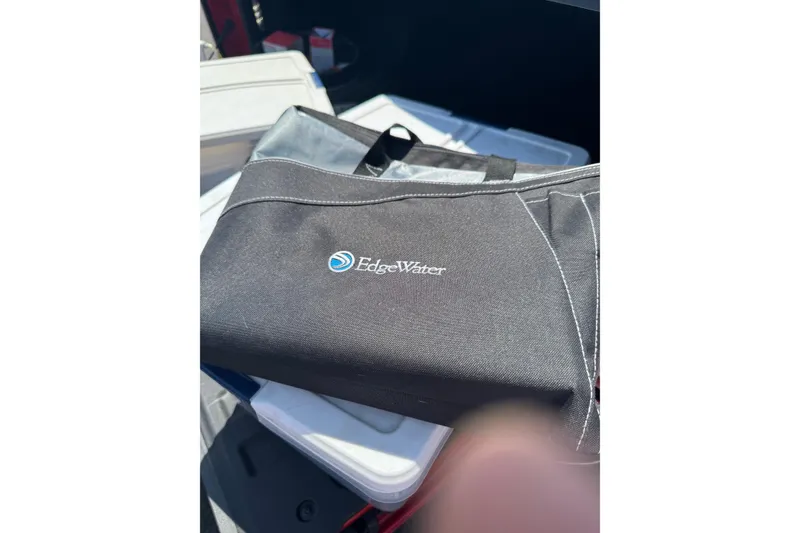 Slide: The Image of Black Edgewater bag on a stack of boxes, showcasing the 2018 Edgewater 158CS model. - 14