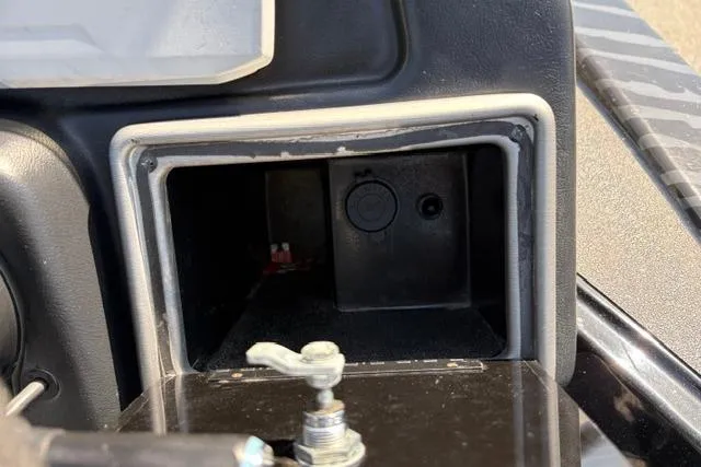 Slide: The Image of 2023 Caymas CX 20 PRO dashboard compartment, open and empty, with visible latch mechanism. - 29
