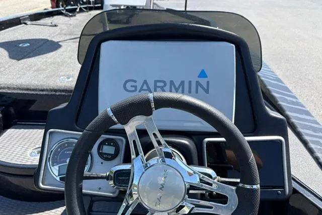 Slide: The Image of 2023 Caymas CX 20 PRO boat dashboard with Garmin display and steering wheel. - 27