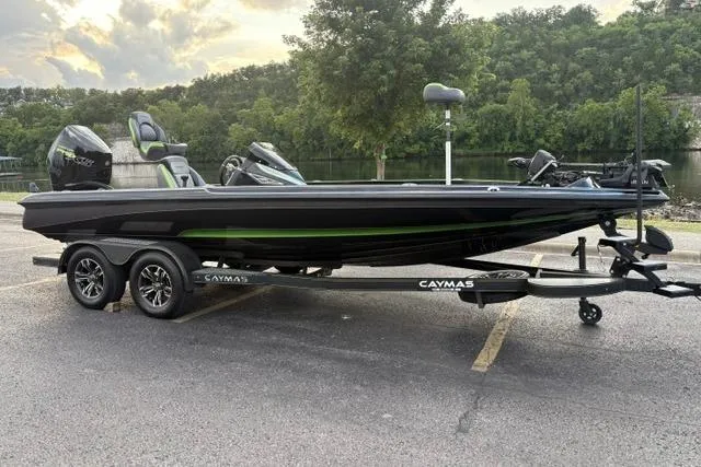 Slide: The Image of 2023 Caymas CX 20 PRO boat on trailer, parked near a scenic lake. - 15