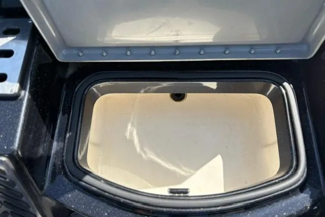 Slide: The Image of Open storage compartment in 2023 Caymas CX 20 PRO boat, showcasing interior space. - 24