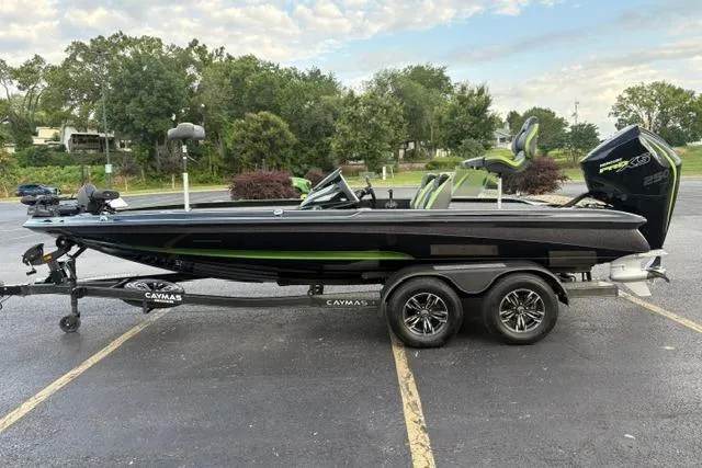 Slide: The Image of 2023 Caymas CX 20 PRO boat on trailer, parked outdoors. - 7