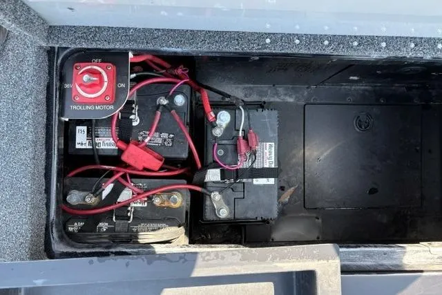 Slide: The Image of 2023 Caymas CX 20 PRO boat battery compartment with trolling motor switch and wiring. - 47