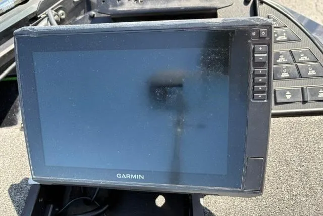 Slide: The Image of Garmin display on 2023 Caymas CX 20 PRO boat dashboard, featuring control buttons. - 16
