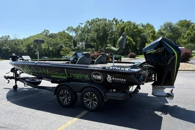 Slide: The Image of 2023 Caymas CX 20 PRO fishing boat on trailer, parked outdoors. - 8