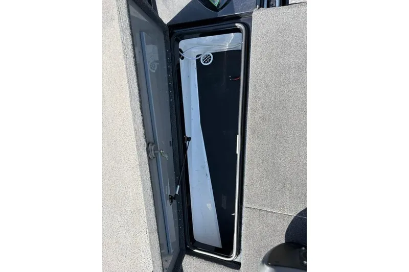 Slide: The Image of Open storage compartment on 2023 Caymas CX 20 PRO boat deck. - 13
