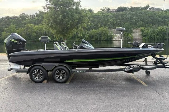 The Image of 2023 Caymas CX 20 PRO boat on trailer by a scenic lake. - 0