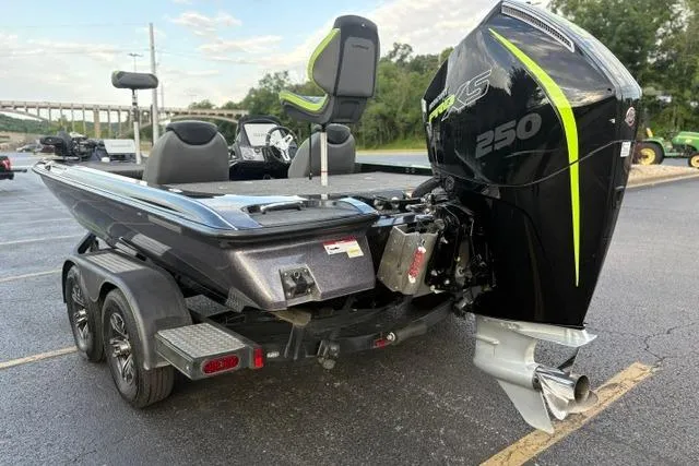 Slide: The Image of 2023 Caymas CX 20 PRO boat with powerful 250 HP engine, parked on a trailer. - 4