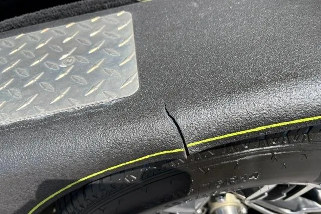 Slide: The Image of Cracked fender on 2023 Caymas CX 20 PRO boat trailer with diamond plate detail. - 50