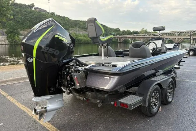 Slide: The Image of 2023 Caymas CX 20 PRO boat with powerful engine, parked near a scenic river. - 16