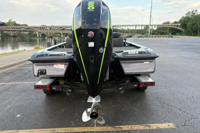 Slide: The Image of 2023 Caymas CX 20 PRO boat with powerful outboard motor, parked near a scenic river. - 6