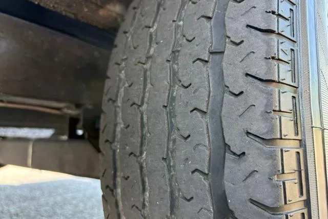 Slide: The Image of Close-up of a worn tire on a 2023 Caymas CX 20 PRO vehicle. - 56