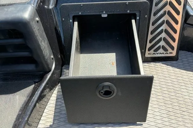 Slide: The Image of Open storage compartment in 2023 Caymas CX 20 PRO boat interior. - 22