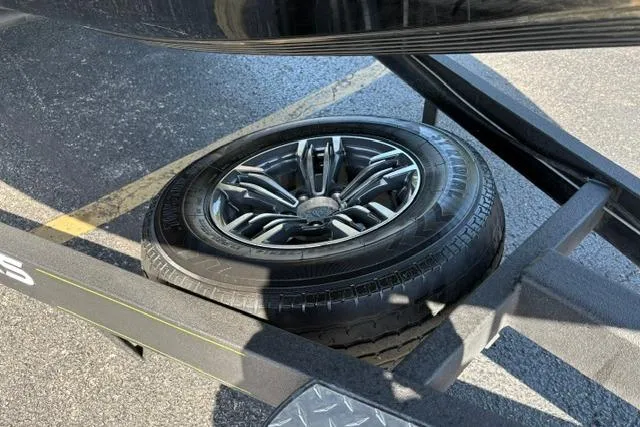 Slide: The Image of 2023 Caymas CX 20 PRO trailer with spare tire on asphalt surface. - 51