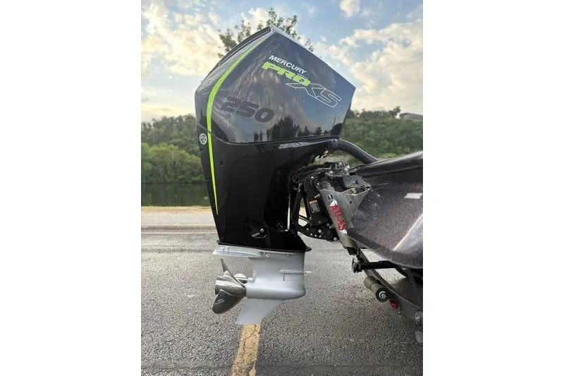 Slide: The Image of 2023 Caymas CX 20 PRO with Mercury Pro XS 250 engine, parked on a road. - 10