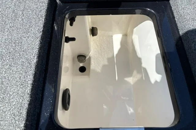 Slide: The Image of 2023 Caymas CX 20 PRO boat storage compartment, open and empty. - 19