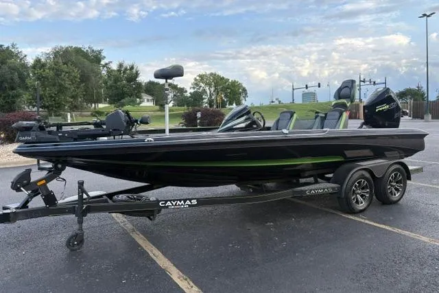 Slide: The Image of 2023 Caymas CX 20 PRO boat on trailer in parking lot, side view. - 2