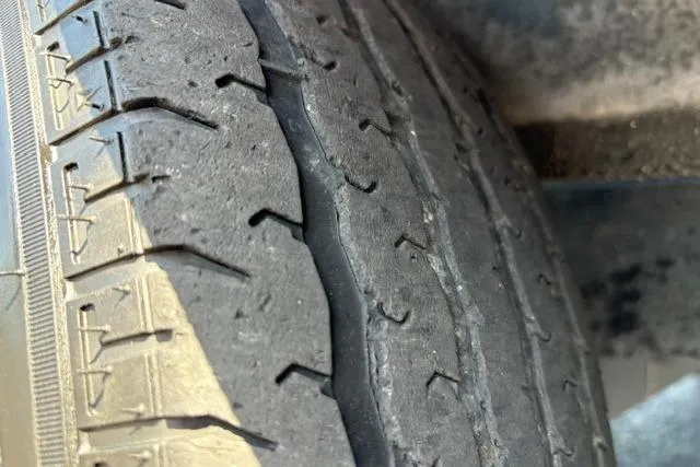 Slide: The Image of Worn tire tread on a 2023 Caymas CX 20 PRO vehicle. - 54