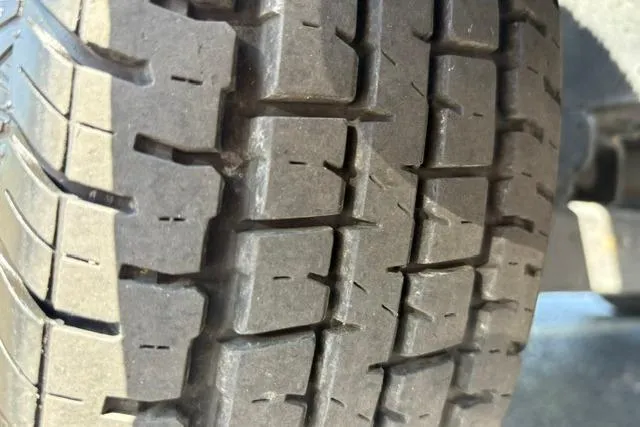 Slide: The Image of Close-up of a 2023 Caymas CX 20 PRO tire tread pattern. - 55