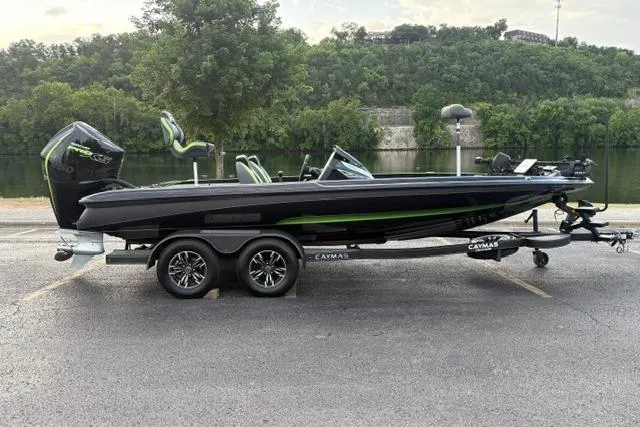 Slide: The Image of 2023 Caymas CX 20 PRO boat on trailer by a scenic lake. - 8