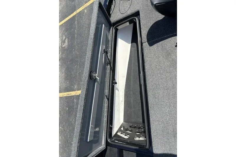 Slide: The Image of Open storage compartment on 2023 Caymas CX 20 PRO boat deck. - 14