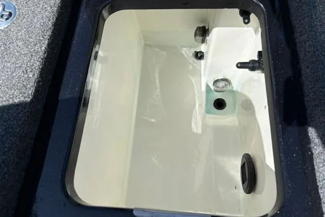 Slide: The Image of 2023 Caymas CX 20 PRO livewell interior with water and drainage system. - 20