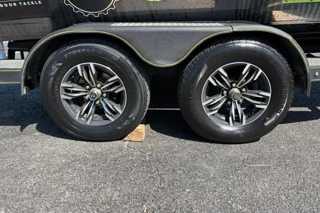 Slide: The Image of 2023 Caymas CX 20 PRO trailer wheels on asphalt, featuring stylish alloy rims. - 52