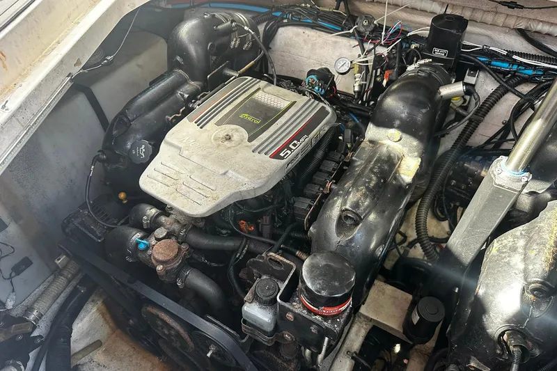 Slide: The Image of Engine compartment of a 2012 Rinker 310 Express Cruiser LE boat. - 55