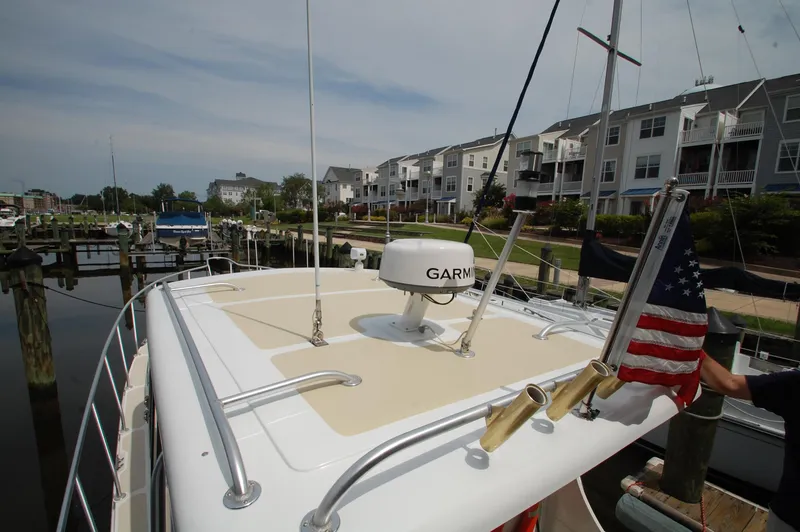 Slide: The Image of A 2005 Fox Island Thirty Sedan Cruiser docked at a marina. - 22