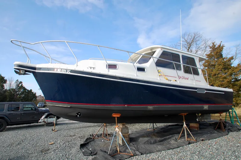 Slide: The Image of A 2005 Fox Island Thirty Sedan Cruiser is on a dry dock. - 37
