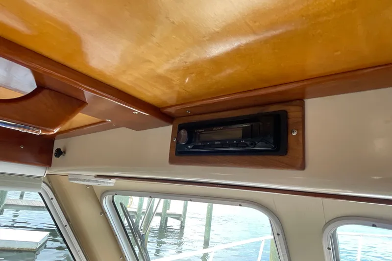 Slide: The Image of Interior of 2005 Fox Island Thirty Sedan Cruiser with wooden ceiling and built-in stereo. - 35