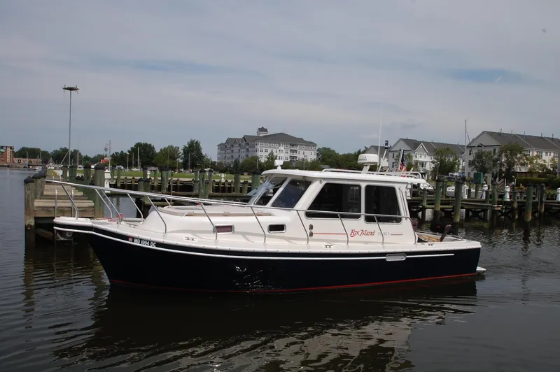 Slide: The Image of A 2005 Fox Island Thirty Sedan Cruiser is anchored in the water. - 38