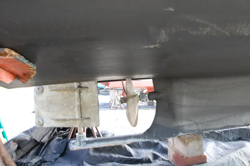 Slide: The Image of Close-up of a boat's underside showing the propeller and rudder. - 29
