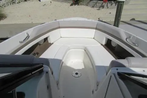 Slide: The Image of 2011 Sea Ray SLX 250 boat interior with white seating and sleek design. - 27
