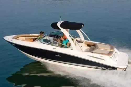 Slide: The Image of 2011 Sea Ray SLX 250 boat cruising on open water, featuring sleek design and spacious seating. - 39