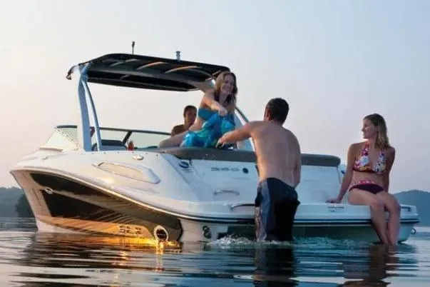 Slide: The Image of 2011 Sea Ray SLX 250 boat with people enjoying a day on the water. - 40