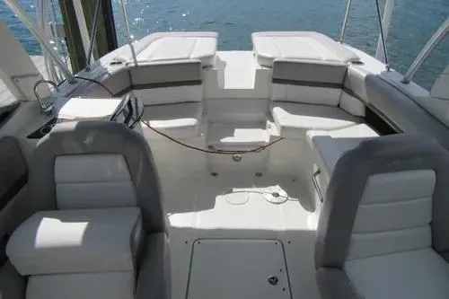 Slide: The Image of 2011 Sea Ray SLX 250 boat interior with white seating and open deck layout. - 24