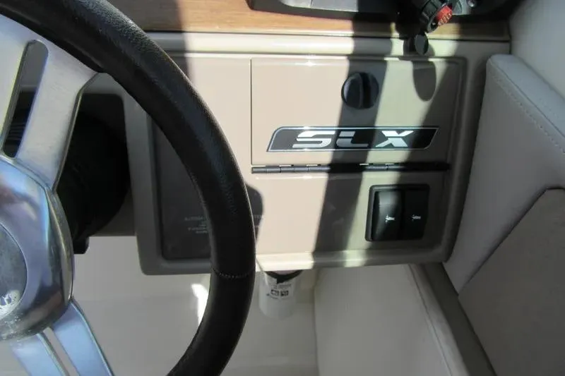 Slide: The Image of Steering wheel and dashboard of a 2011 Sea Ray SLX 250 boat. - 20