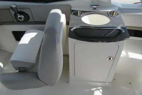 Slide: The Image of 2011 Sea Ray SLX 250 boat interior with seating and sink area. - 32