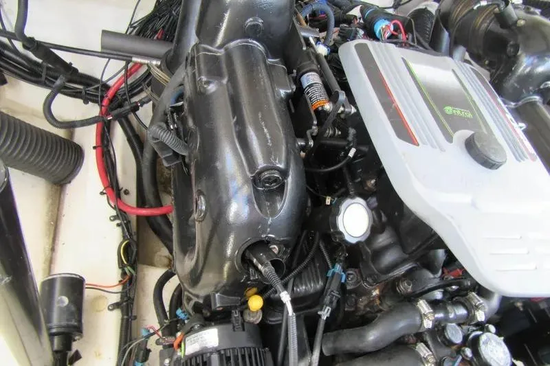 Slide: The Image of Engine compartment of a 2011 Sea Ray SLX 250 boat, showcasing detailed components. - 7