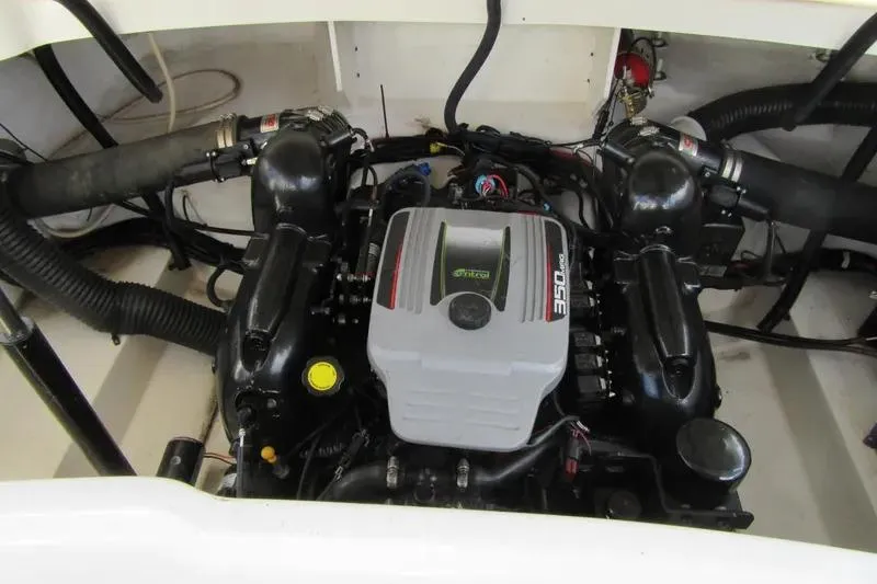Slide: The Image of Engine compartment of a 2011 Sea Ray SLX 250 boat, showcasing the powerful engine setup. - 6