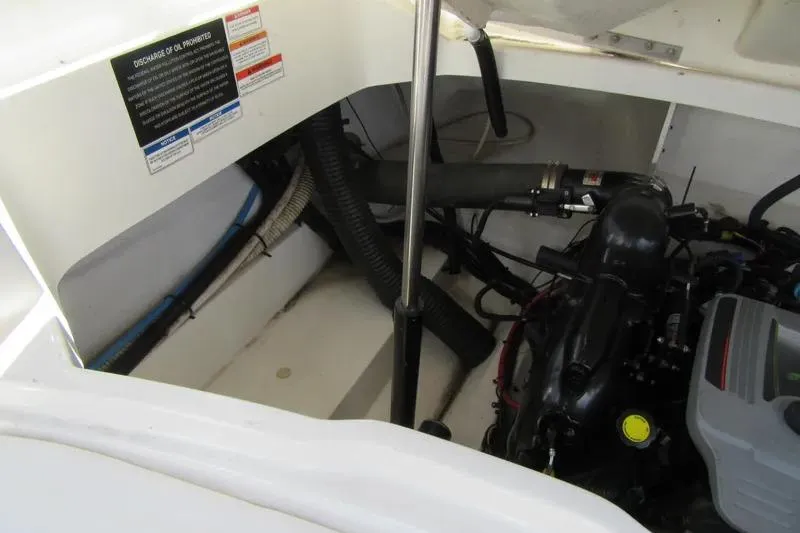Slide: The Image of Engine compartment of a 2011 Sea Ray SLX 250 boat, showcasing mechanical components. - 8