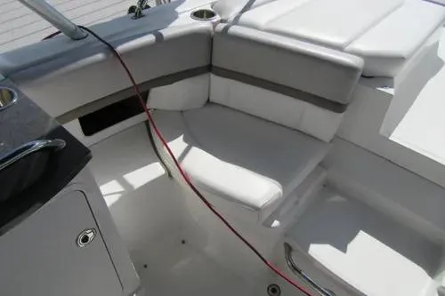 Slide: The Image of 2011 Sea Ray SLX 250 boat interior with white seating and sleek design. - 33