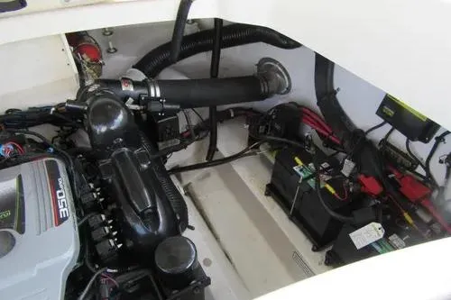 Slide: The Image of Engine compartment of a 2011 Sea Ray SLX 250 boat, showcasing engine and battery components. - 9