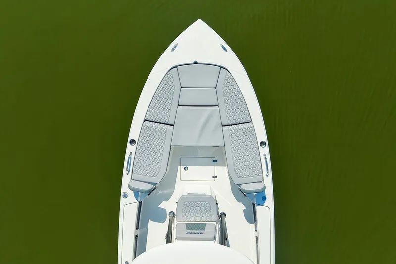 Slide: The Image of Top view of 2027 Pathfinder 2200 Hybrid boat with cushioned seating on green water. - 13