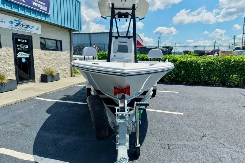 Slide: The Image of 2027 Pathfinder 2200 TRS boat on trailer at dealership, sunny day. - 29